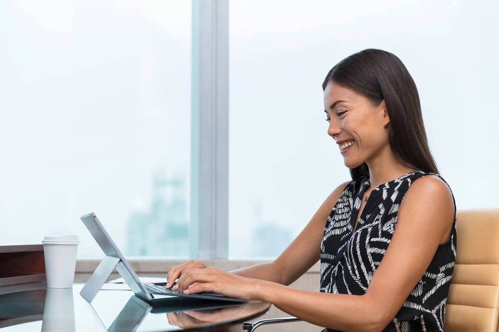 bigstock-Asian-business-woman-typing-on-220991110